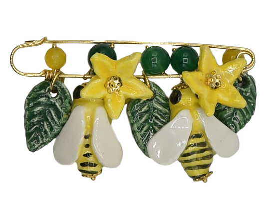 Golden brooch with bees, flowers and hanging leaves