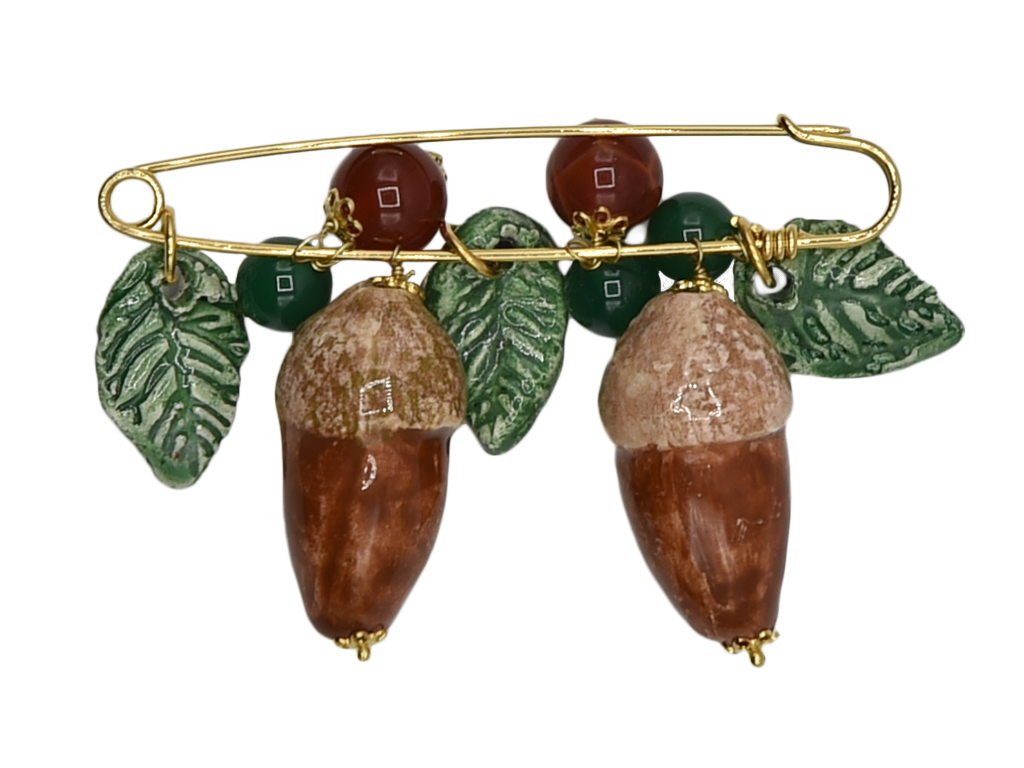 Golden brooch with acorns and hanging leaves in ceramic and semiprecious stone beads