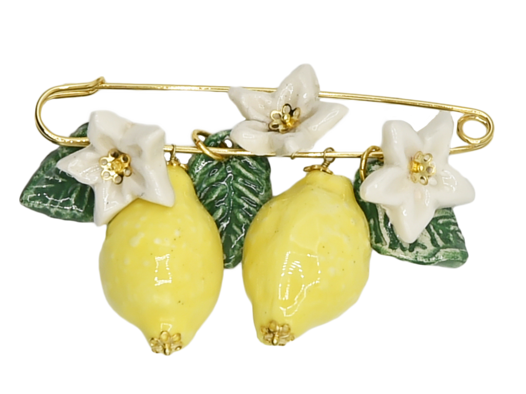 Golden brooch with lemons, flowers and hanging leaves