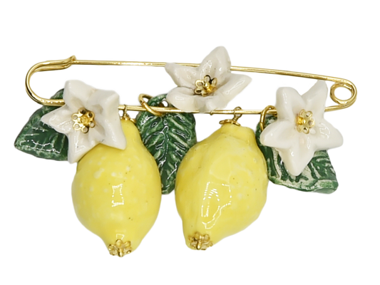 Golden brooch with lemons, flowers and hanging leaves