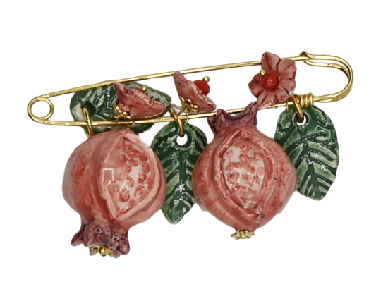 Golden brooch with pomegranates, flowers and hanging leaves