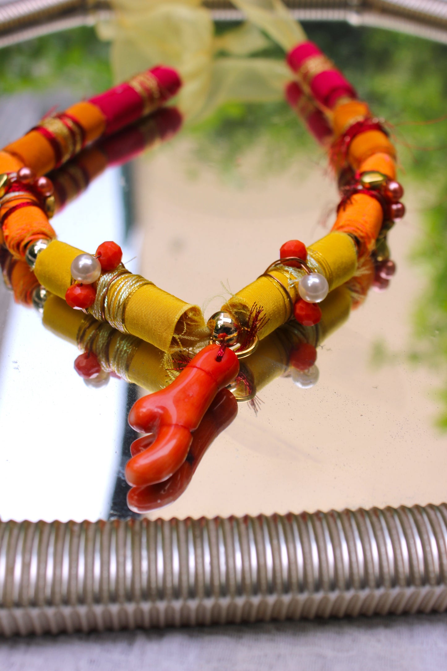 Necklace with coral pendant