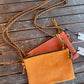 Yellow and orange suede cross body bags
