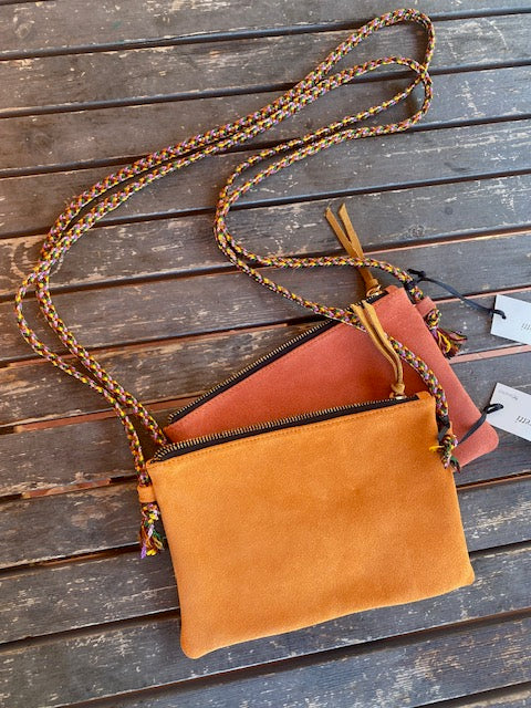 Yellow and orange suede cross body bags