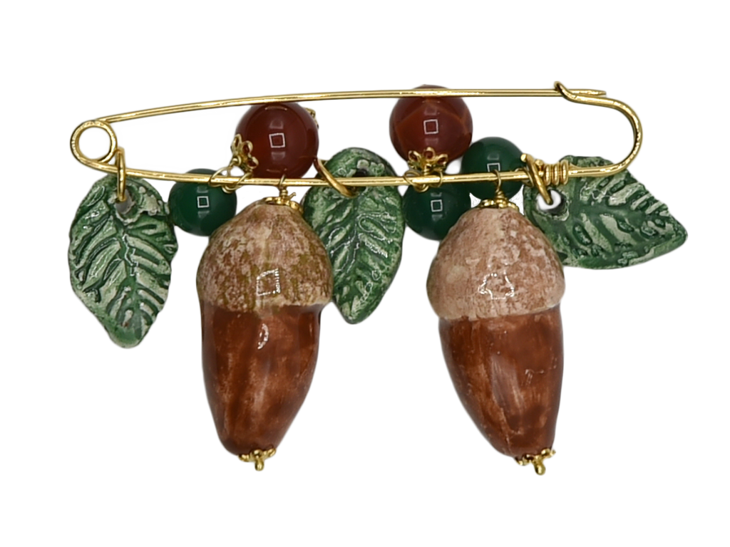 Golden brooch with acorns and hanging leaves in ceramic and semiprecious stone beads 
