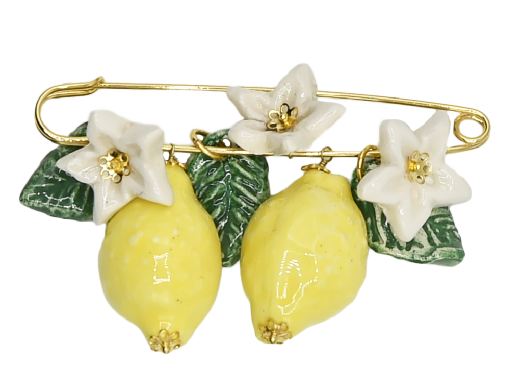 Golden brooch with lemons, flowers and hanging leaves 